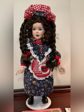 Hannah Porcelain Doll in Navy Floral Dress with Red Gingham Accents